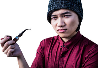 Thoughtful hipster smoking pipe