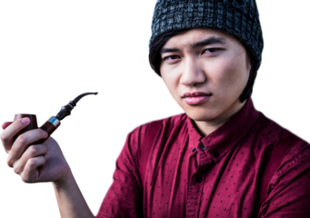 Thoughtful hipster smoking pipe