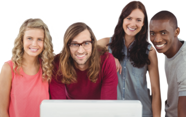 Portrait of smiling business team standing at computer desk 