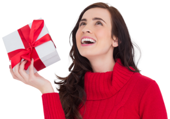 Happy brunette in red jumper hat showing a gift