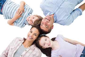 Happy parents and children lying on white background
