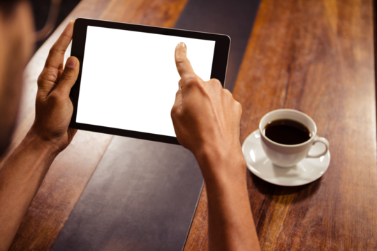 Cropped image of man pointing at digital tablet