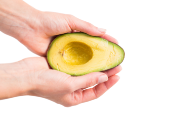 Woman presenting half of an avocado