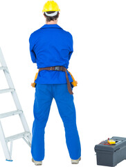 Electrician standing against white background
