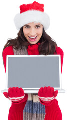 Festive brunette showing a laptop