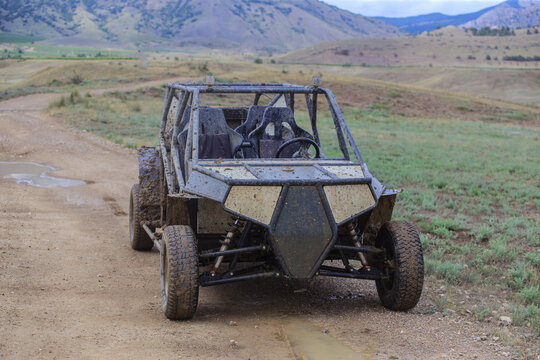 Buggy on rugged mountainous terrain