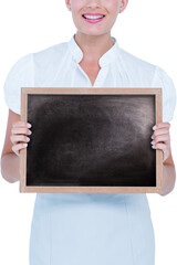 Mid section of woman holding blackboard