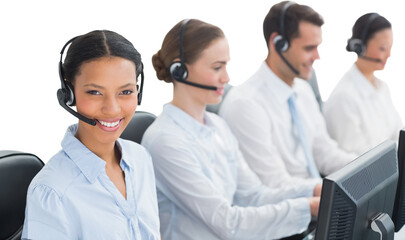 Business people with headsets using computers 