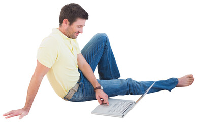 Smiling man using a laptop