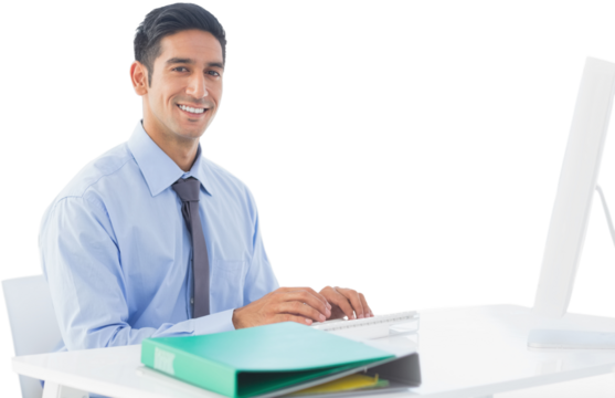 Portrait of handsome businessman using computer at desk