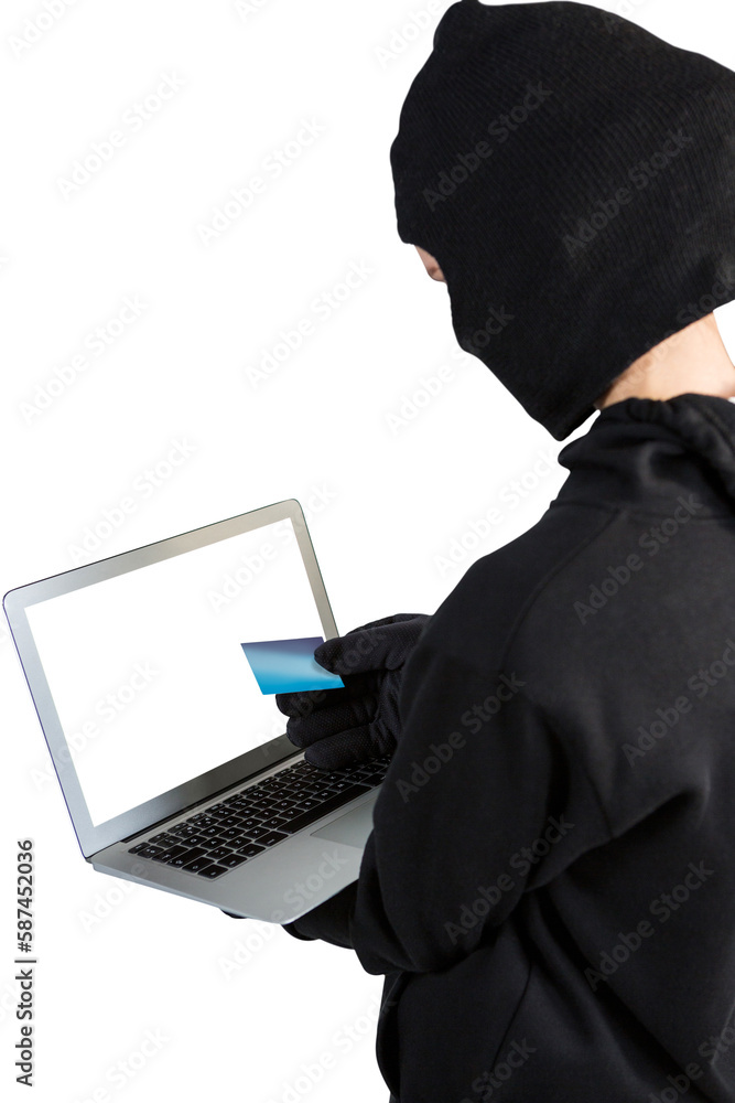 Poster hacker using laptop and debit card