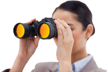 Brunette businesswoman looking through binoculars
