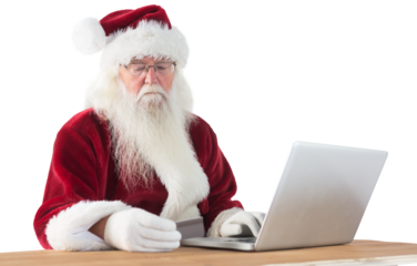 Santa pays with credit card on a laptop