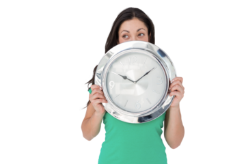 Brunette holding wall clock