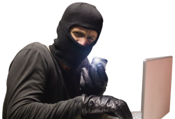 Hacker using laptop to steal identity