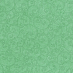 Cardboard background with an embossed floral pattern. Elegant background in green tones.
