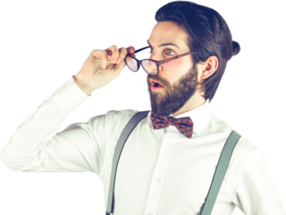 Surprised man holding eyeglasses while looking away