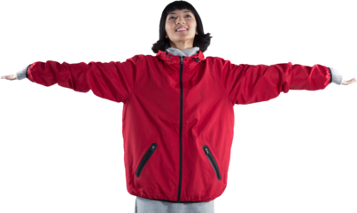 Smiling woman standing with arms outstretched