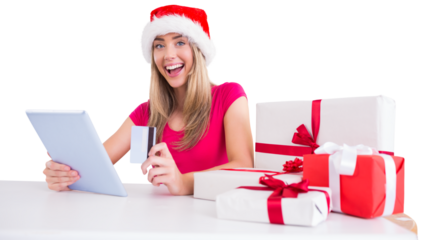 Festive blonde shopping online with tablet