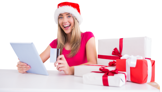 Festive blonde shopping online with tablet