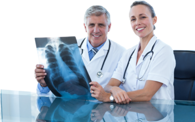 Portrait of male and female doctors with chest X-ray