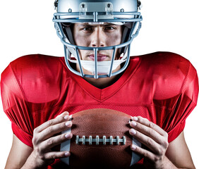 Close-up portrait of confident American football player holding ball