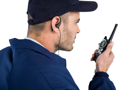 Close up of security officer talking on walkie talkie - Powered by Adobe