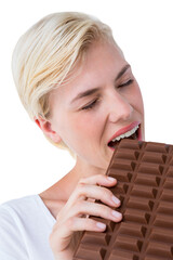 Attractive woman eating big bar of chocolate