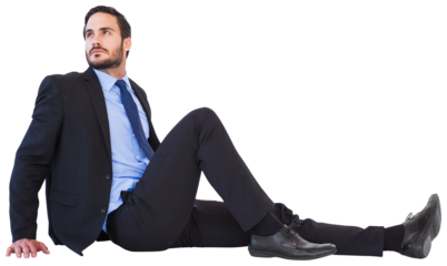 Relaxed businessman sitting on the floor