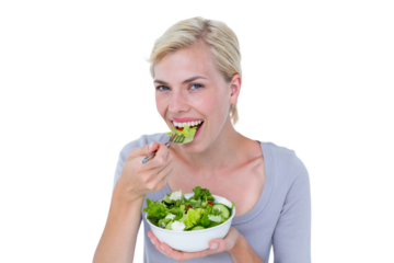 Happy blonde woman holding bowl of salad