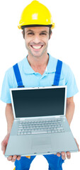 Happy repairman wearing hard hat while holding laptop