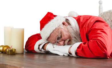 Santa Claus sleeping at desk