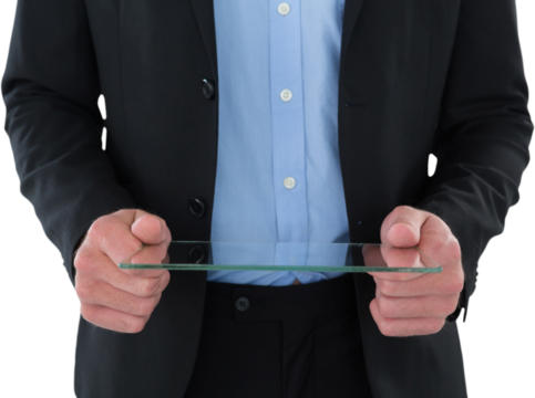 Mid section of businessman holding glass interface