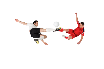 Football players tackling for the ball