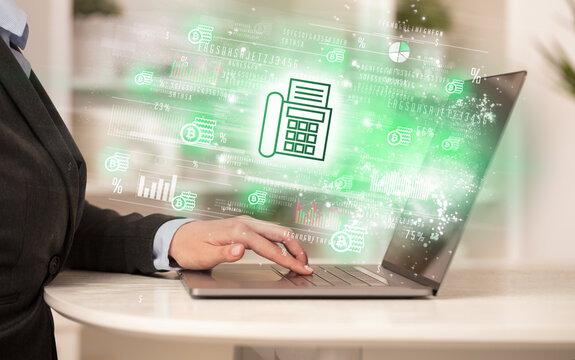 Young man watching stock market on laptop