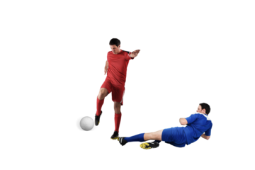 Football players tackling for the ball