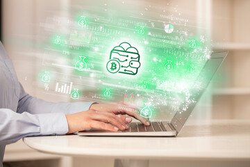 Young man watching stock market on laptop