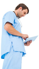 Handsome surgeon using tablet pc