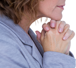 Side view of upset woman with hands clasped