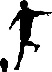 Rugby player kicking ball