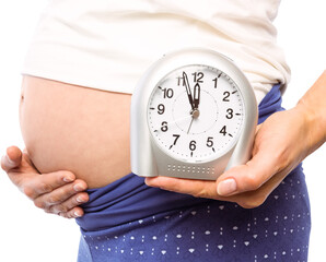 Pregnant woman showing clock and bump