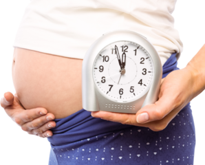 Pregnant woman showing clock and bump