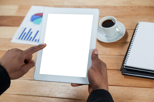 Close up of hand using digital tablet