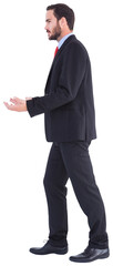 Businessman walking and presenting with hands