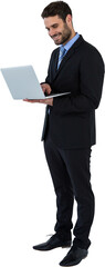 Businessman standing while using laptop computer