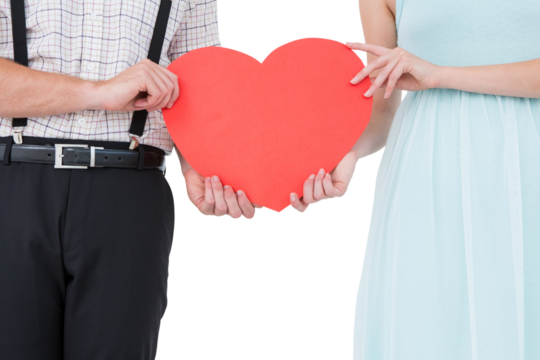 Hipster couple holding heart card