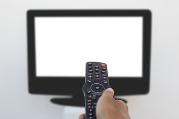 Hand holding remote and changing channel