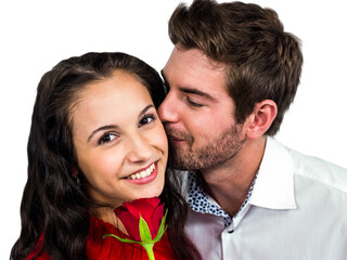 Smiling couple holding rose