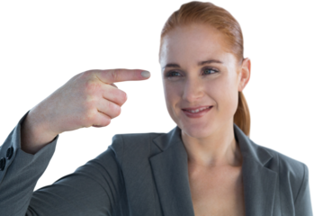 Smiling businesswoman looking at index finger