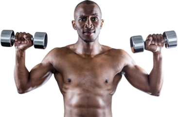 Portrait of athlete lifting dumbbell while exercising
